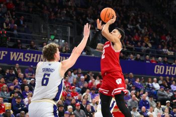 Feb 28, 2026; Seattle, Washington, USA; Wisconsin Badgers guard Nick Boyd (2) shoots the ball over Washington Huskies forward Hannes Steinbach (6) during the second half at Alaska Airlines Arena at Hec Edmundson Pavilion. Mandatory Credit: Steven Bisig-Imagn Images