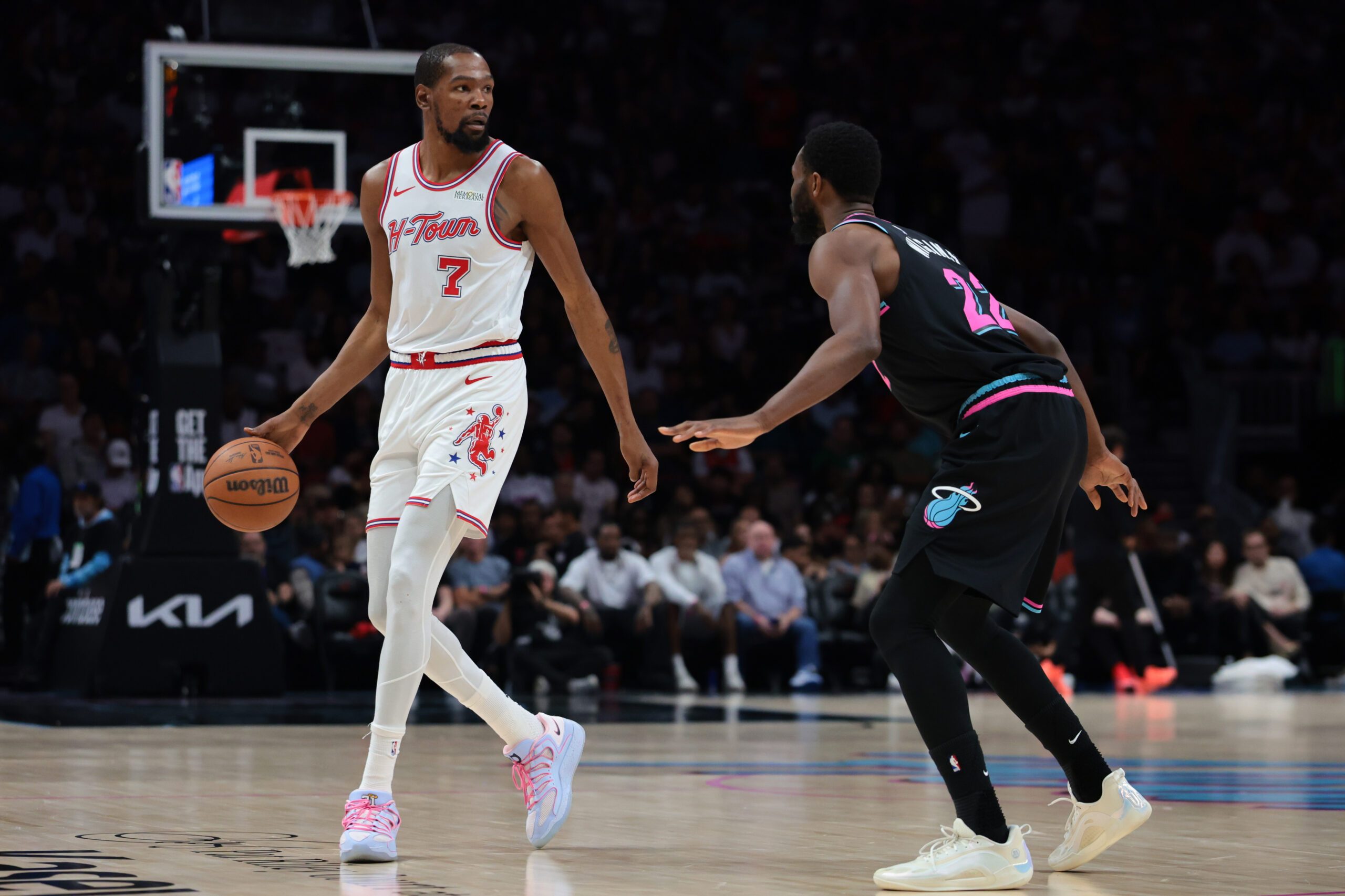 Feb 28, 2026; Miami, Florida, USA; Houston Rockets forward Kevin Durant (7) dribbles the basketball as Miami Heat forward Andrew Wiggins (22) defends during the second quarter at Kaseya Center. Mandatory Credit: Sam Navarro-Imagn Images