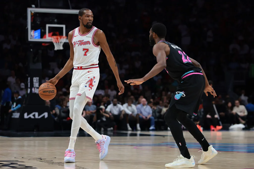 Feb 28, 2026; Miami, Florida, USA; Houston Rockets forward Kevin Durant (7) dribbles the basketball as Miami Heat forward Andrew Wiggins (22) defends during the second quarter at Kaseya Center. Mandatory Credit: Sam Navarro-Imagn Images