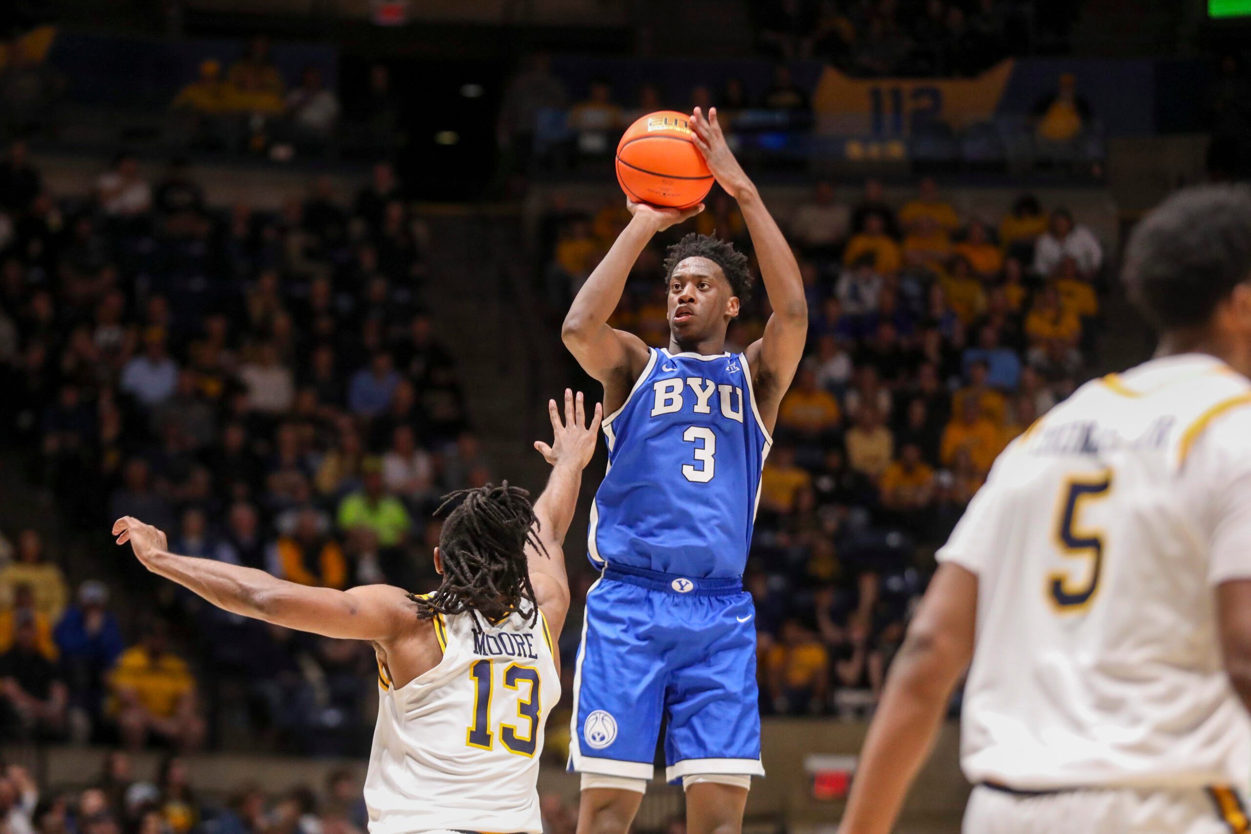 Feb 28, 2026; Morgantown, West Virginia, USA; BYU Cougars forward AJ Dybantsa (3) shoots a three point shot over West Virginia Mountaineers guard Chance Moore (13) during the first half at Hope Coliseum. Mandatory Credit: Ben Queen-Imagn Images