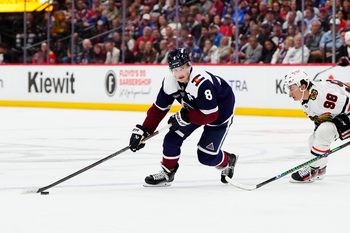 Feb 28, 2026; Denver, Colorado, USA; Colorado Avalanche defenseman Cale Makar (8) controls the puck in the second period against the Chicago Blackhawks at Ball Arena. Mandatory Credit: Ron Chenoy-Imagn Images