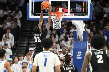 Feb 28, 2026; Omaha, Nebraska, USA;  Providence Friars forward Oswin Erhunmwunse (55) dunks against the Creighton Bluejays during the second half at CHI Health Center Omaha. Mandatory Credit: Steven Branscombe-Imagn Images