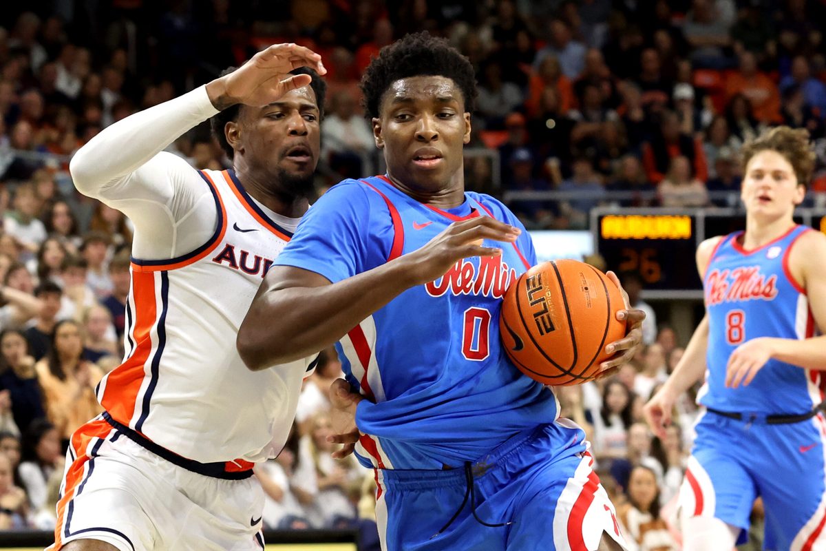 Feb 28, 2026; Auburn, Alabama, USA; Mississippi Rebels forward Malik Dia (0) gets tangled up with Auburn Tigers guard Kevin Overton (1) during the first half at Neville Arena. Mandatory Credit: John Reed-Imagn Images
