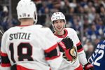 Feb 28, 2026; Toronto, Ontario, CAN;   Ottawa Senators forward Dylan Cozens (24) celebrates with forward Tim Stutzle (18) after scoring a goal against the Toronto Maple Leafs in the second period at Scotiabank Arena. Mandatory Credit: Dan Hamilton-Imagn Images