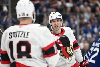 Feb 28, 2026; Toronto, Ontario, CAN;   Ottawa Senators forward Dylan Cozens (24) celebrates with forward Tim Stutzle (18) after scoring a goal against the Toronto Maple Leafs in the second period at Scotiabank Arena. Mandatory Credit: Dan Hamilton-Imagn Images