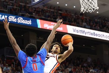 Feb 28, 2026; Auburn, Alabama, USA;  Auburn Tigers guard Keyshawn Hall (7) takes a shot against Mississippi Rebels forward Malik Dia (0) during the second half at Neville Arena. Mandatory Credit: John Reed-Imagn Images