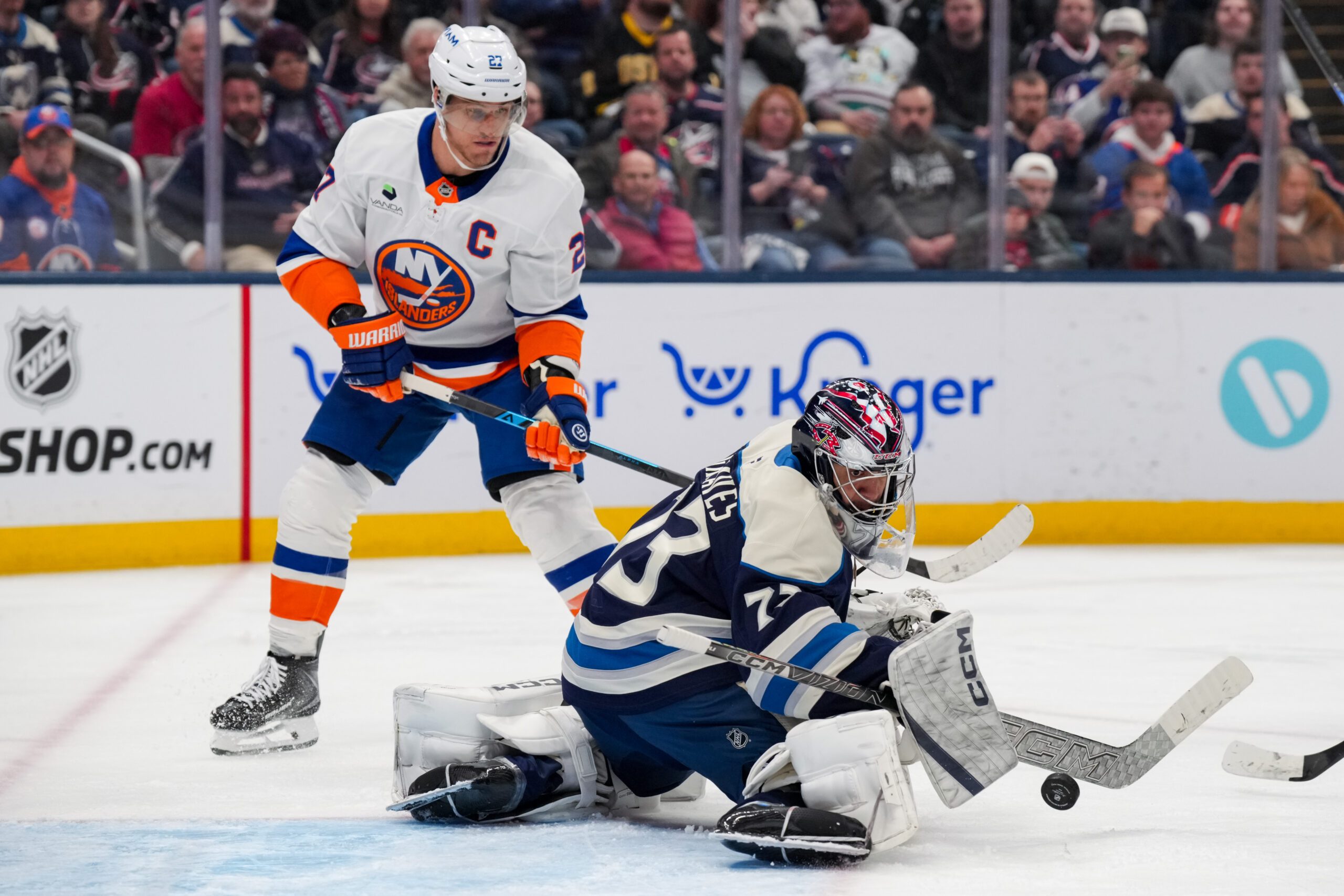 Feb 28, 2026; Columbus, Ohio, USA;  Columbus Blue Jackets goaltender Jet Greaves (73) makes a save in net against New York Islanders left wing Anders Lee (27) in the third period at Nationwide Arena. Mandatory Credit: Aaron Doster-Imagn Images