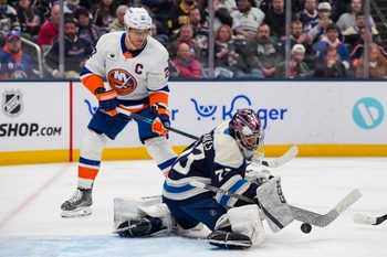 Feb 28, 2026; Columbus, Ohio, USA;  Columbus Blue Jackets goaltender Jet Greaves (73) makes a save in net against New York Islanders left wing Anders Lee (27) in the third period at Nationwide Arena. Mandatory Credit: Aaron Doster-Imagn Images