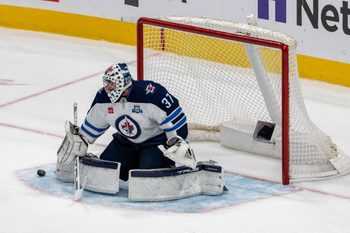 March 1, 2026; San Jose, California, USA; Winnipeg Jets goaltender Connor Hellebuyck (37) makes a save against the San Jose Sharks during the third period at SAP Center at San Jose. Mandatory Credit: Neville E. Guard-Imagn Images