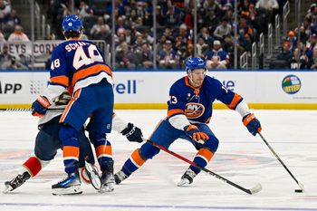 Mar 1, 2026; Elmont, New York, USA;  New York Islanders center Mathew Barzal (13) skates around New York Islanders defenseman Matthew Schaefer (48) against the Florida Panthers during the first period at UBS Arena. Mandatory Credit: Dennis Schneidler-Imagn Images