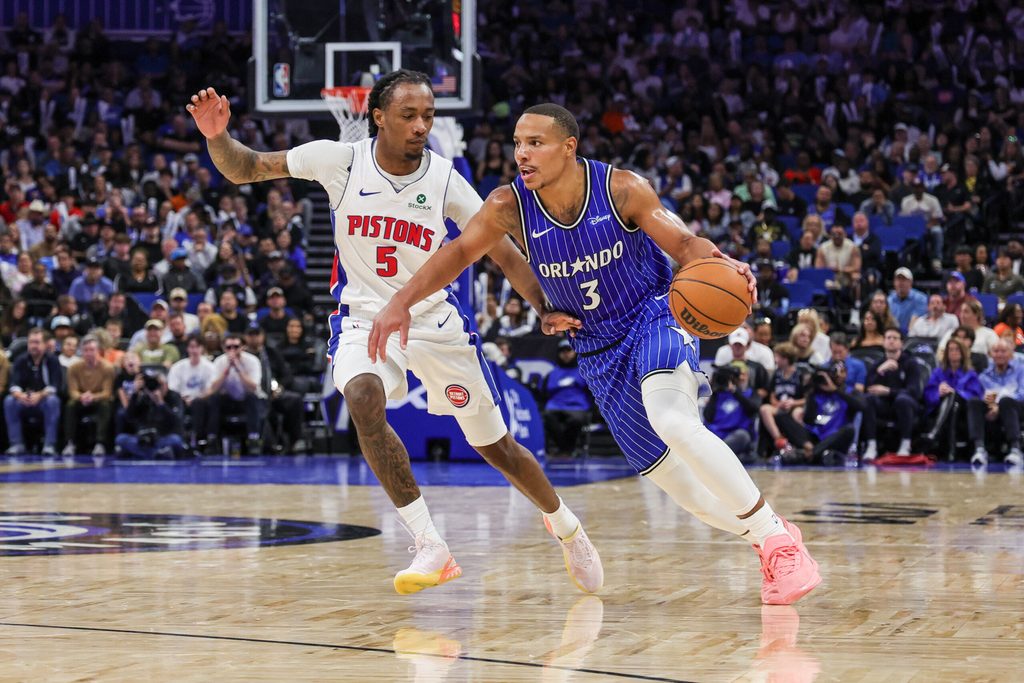 Mar 1, 2026; Orlando, Florida, USA; Orlando Magic guard Desmond Bane (3) drives past Detroit Pistons forward Ronald Holland II (5) during the second half at Kia Center. Mandatory Credit: Mike Watters-Imagn Images