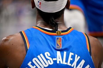 Mar 1, 2026; Dallas, Texas, USA; A view of the gold NBA logo on the jersey of Oklahoma City Thunder guard Shai Gilgeous-Alexander (2) during the second half against the Dallas Mavericks at the American Airlines Center. Mandatory Credit: Jerome Miron-Imagn Images