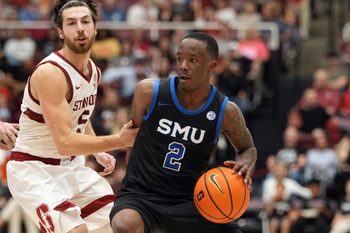 Feb 28, 2026; Stanford, California, USA; Southern Methodist University Mustangs guard Boopie Miller (2) dribbles against Stanford Cardinal guard Benny Gealer (5) during the second half at Maples Pavilion. Mandatory Credit: Darren Yamashita-Imagn Images