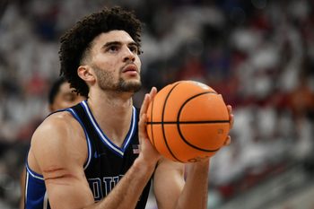 Mar 2, 2026; Raleigh, North Carolina, USA;  Duke Blue Devils forward Cameron Boozer (12) shoots a free throw during the second half against the NC State Wolfpack at Lenovo Center. Mandatory Credit: Zachary Taft-Imagn Images