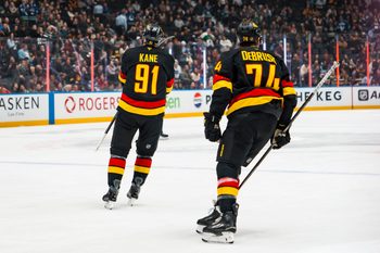 Mar 2, 2026; Vancouver, British Columbia, CAN; Vancouver Canucks forward Jake DeBrusk (74) and forward Evander Kane (91) celebrate Kane’s goal against the Dallas Stars in the first period at Rogers Arena. Mandatory Credit: Bob Frid-Imagn Images