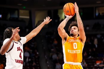 Mar 3, 2026; Columbia, South Carolina, USA; Tennessee Volunteers guard Ja'kobi Gillespie (0) shoots over South Carolina Gamecocks guard Kobe Knox (4) in the second half at Colonial Life Arena. Mandatory Credit: Jeff Blake-Imagn Images