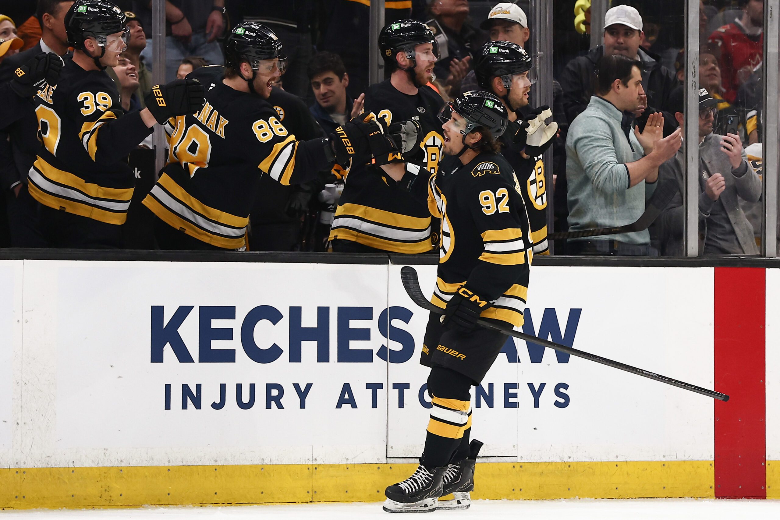 Mar 3, 2026; Boston, Massachusetts, USA; Boston Bruins center Marat Khusnutdinov (92) is congratulated at the bench by right wing David Pastrnak (88) after scoring against the Pittsburgh Penguins during the first period at TD Garden. Mandatory Credit: Winslow Townson-Imagn Images