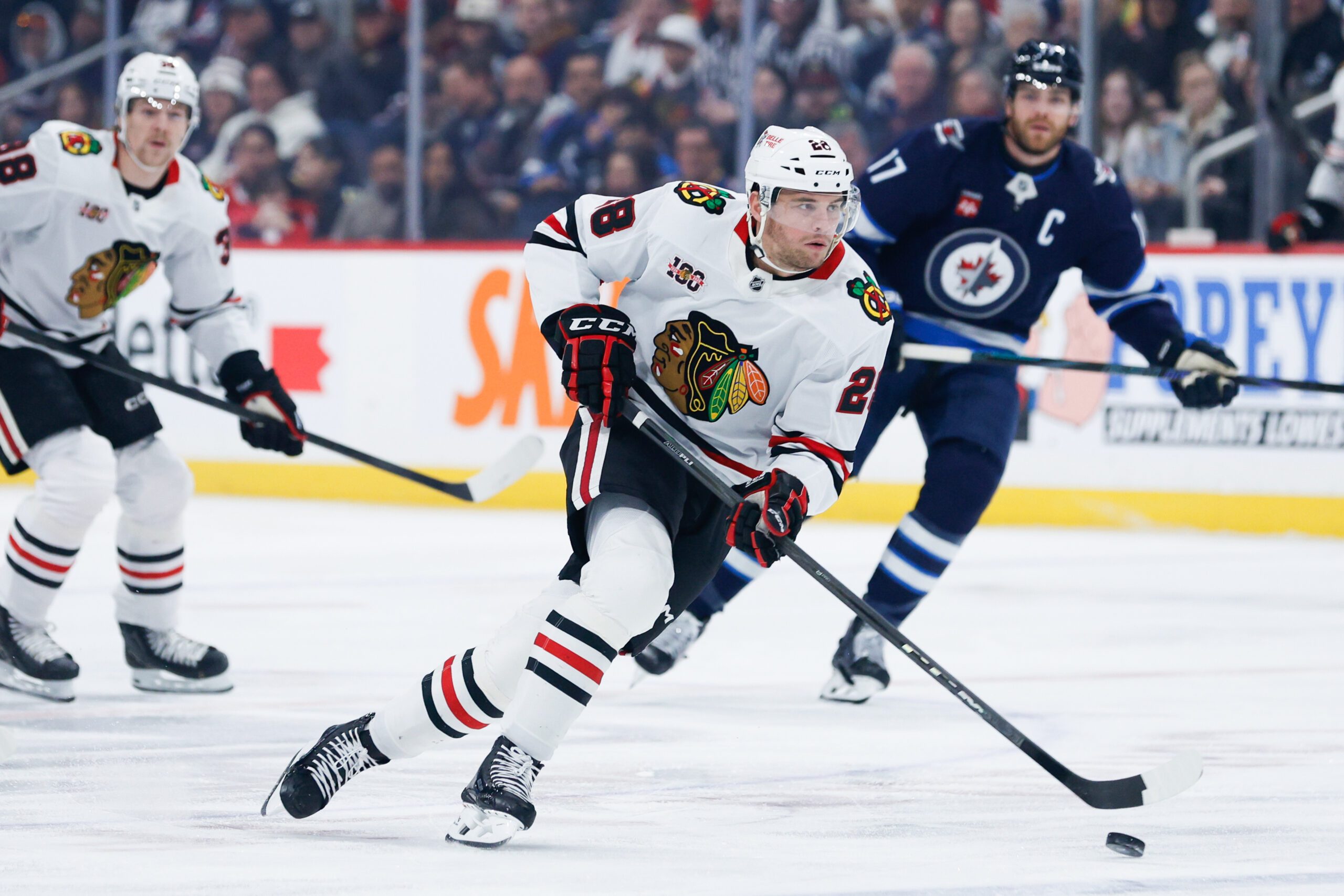 Mar 3, 2026; Winnipeg, Manitoba, CAN;  Chicago Blackhawks forward Andre Burakovsky (28) skates into the Winnipeg Jets zone during the first period at Canada Life Centre. Mandatory Credit: Terrence Lee-Imagn Images