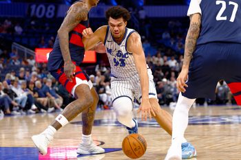 Mar 3, 2026; Orlando, Florida, USA;  Orlando Magic forward Noah Penda (93) drives to the basket in the second half against the Washington Wizards at Kia Center. Mandatory Credit: Russell Lansford-Imagn Images