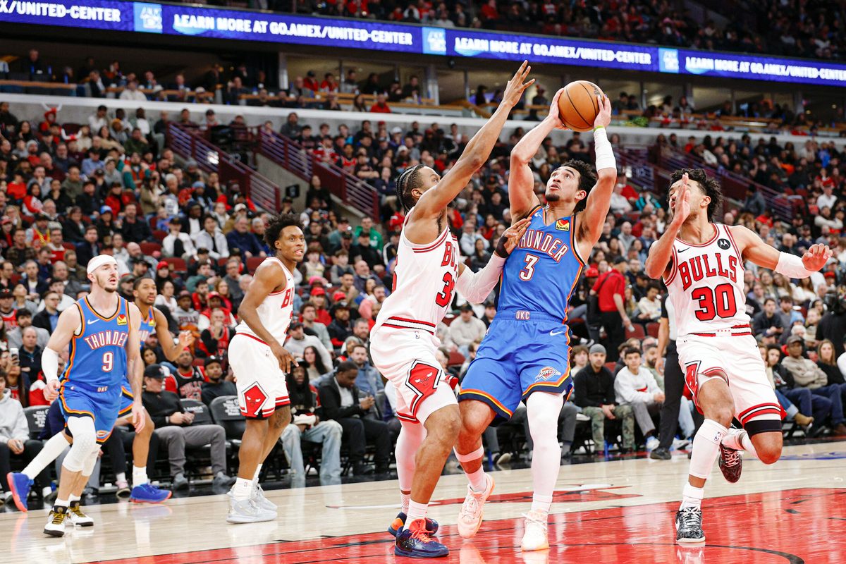 Mar 3, 2026; Chicago, Illinois, USA; Oklahoma City Thunder guard Jared McCain (3) shoots against Chicago Bulls forward Isaac Okoro (35) during the second half at United Center. Mandatory Credit: Kamil Krzaczynski-Imagn Images