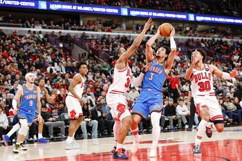 Mar 3, 2026; Chicago, Illinois, USA; Oklahoma City Thunder guard Jared McCain (3) shoots against Chicago Bulls forward Isaac Okoro (35) during the second half at United Center. Mandatory Credit: Kamil Krzaczynski-Imagn Images