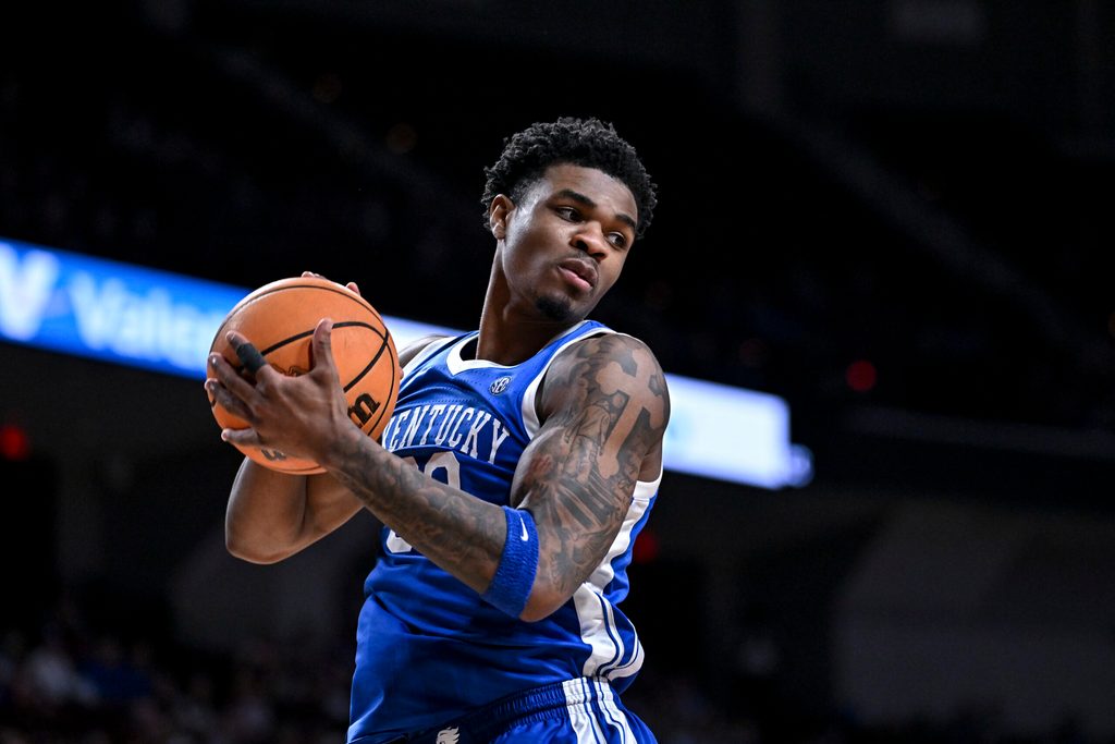 Mar 3, 2026; College Station, Texas, USA; Kentucky Wildcats guard Otega Oweh (00) secures a rebound during the second half against the Texas A&M Aggies at Reed Arena. Mandatory Credit: Maria Lysaker-Imagn Images