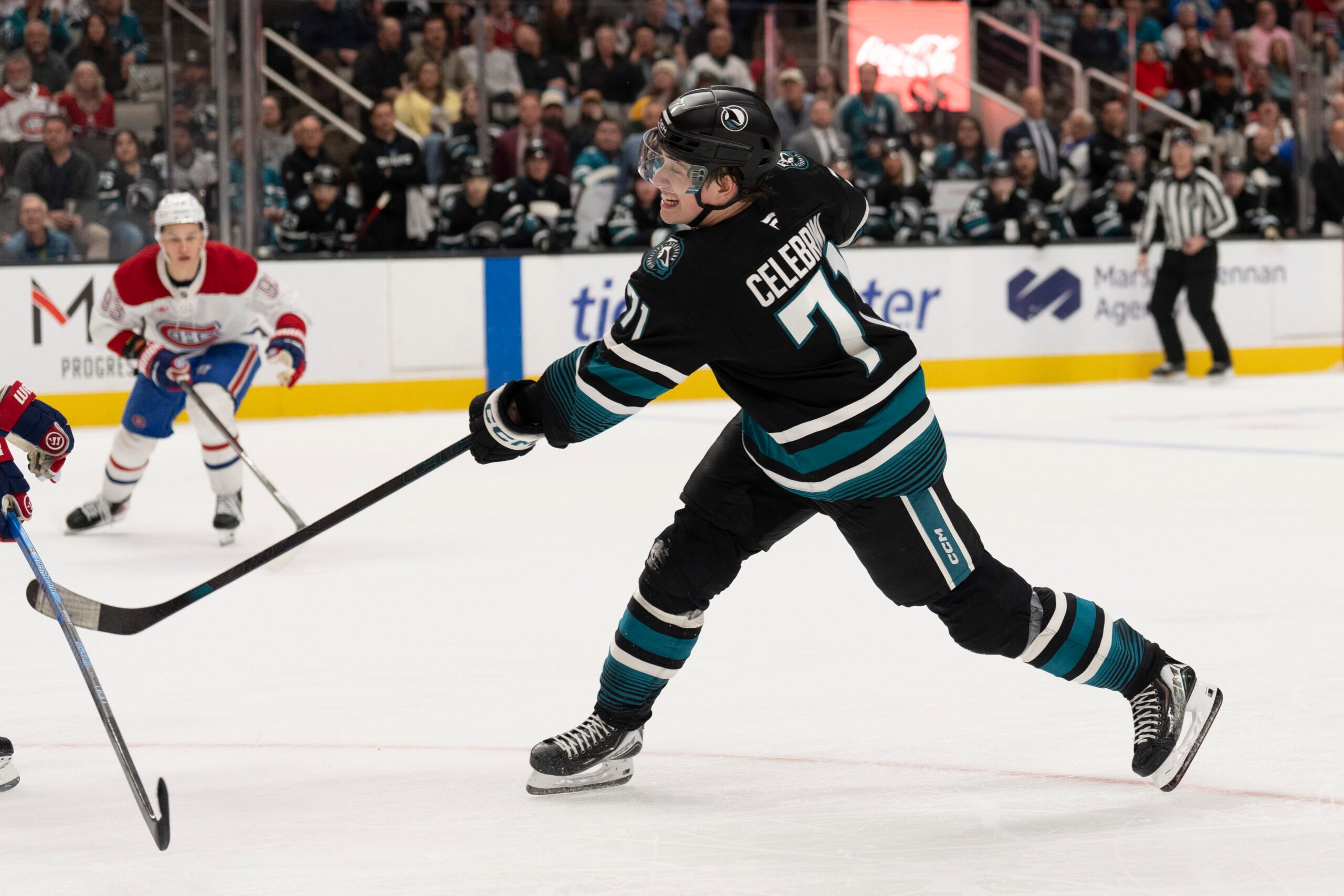 Mar 3, 2026; San Jose, California, USA;  San Jose Sharks center Macklin Celebrini (71) shoots the puck and scores a goal during the second period against the Montreal Canadiens at SAP Center at San Jose. Mandatory Credit: Stan Szeto-Imagn Images