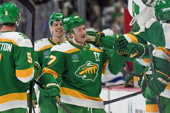 Mar 3, 2026; Saint Paul, Minnesota, USA;  Minnesota Wild forward Kirill Kaprizov (97) is congratulated by teammates after taking sole possession as the franchise leader in goals on an empty netter against the Tampa Bay Lightning during the third period at Grand Casino Arena. Mandatory Credit: Nick Wosika-Imagn Images