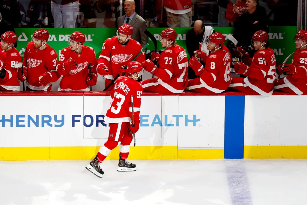 Mar 4, 2026; Detroit, Michigan, USA; Detroit Red Wings right wing Alex DeBrincat (93) receives congratulations from teammates after scoring in the first period against the Vegas Golden Knights at Little Caesars Arena. Mandatory Credit: Rick Osentoski-Imagn Images