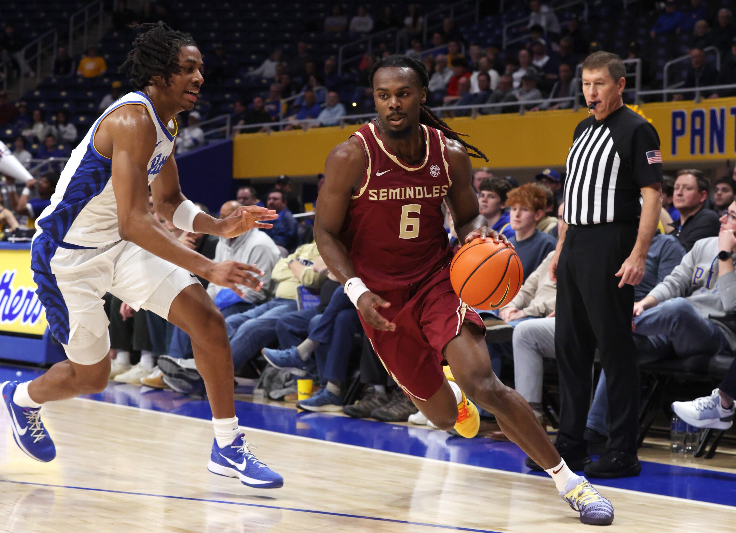 Mar 4, 2026; Pittsburgh, Pennsylvania, USA;  Florida State Seminoles guard Robert McCray V. (6) drives to the basket against Pittsburgh Panthers guard Omari Witherspoon (left) during the first half at the Petersen Events Center. Mandatory Credit: Charles LeClaire-Imagn Images