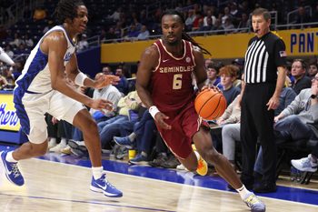 Mar 4, 2026; Pittsburgh, Pennsylvania, USA;  Florida State Seminoles guard Robert McCray V. (6) drives to the basket against Pittsburgh Panthers guard Omari Witherspoon (left) during the first half at the Petersen Events Center. Mandatory Credit: Charles LeClaire-Imagn Images