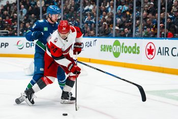 Mar 4, 2026; Vancouver, British Columbia, CAN; Vancouver Canucks forward Elias Pettersson (40) battles with Carolina Hurricanes forward Seth Jarvis (24) in the second at Rogers Arena. Mandatory Credit: Bob Frid-Imagn Images