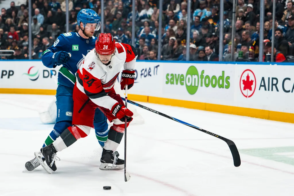 Mar 4, 2026; Vancouver, British Columbia, CAN; Vancouver Canucks forward Elias Pettersson (40) battles with Carolina Hurricanes forward Seth Jarvis (24) in the second at Rogers Arena. Mandatory Credit: Bob Frid-Imagn Images