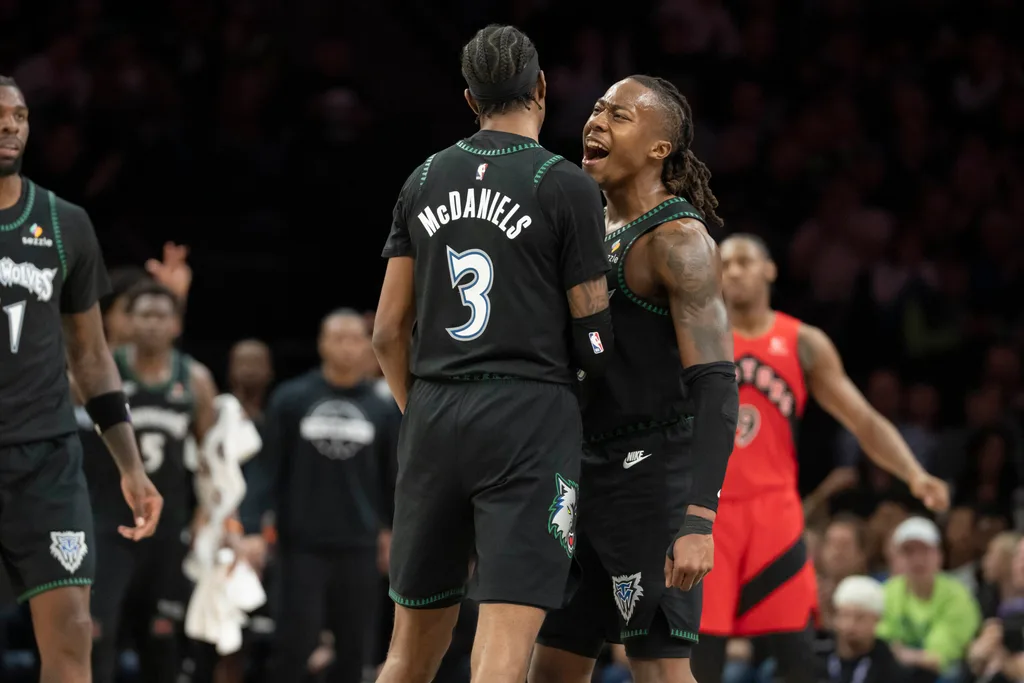 Mar 5, 2026; Minneapolis, Minnesota, USA; Minnesota Timberwolves forward Jaden McDaniels (3) and Minnesota Timberwolves guard Ayo Dosunmu (13) celebrate making a shot against the Toronto Raptors in the second half at Target Center. Mandatory Credit: Jesse Johnson-Imagn Images
