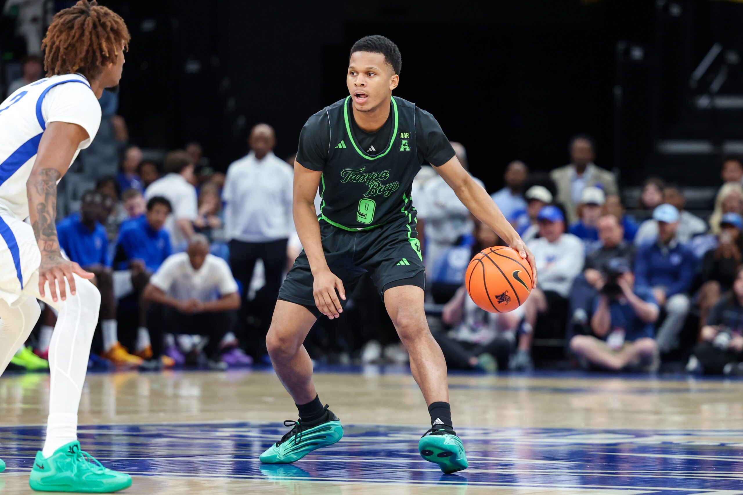 Mar 5, 2026; Memphis, Tennessee, USA; South Florida Bulls guard Gavin Hightower (9) handles the ball against the Memphis Tigers during the second half at FedExForum. Mandatory Credit: Wesley Hale-Imagn Images