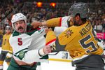 Mar 6, 2026; Las Vegas, Nevada, USA; Minnesota Wild defenseman Jake Middleton (5) fights Vegas Golden Knights right wing Keegan Kolesar (55) during the second period at T-Mobile Arena. Mandatory Credit: Stephen R. Sylvanie-Imagn Images