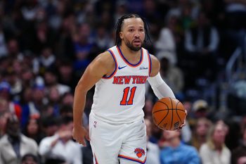 Mar 6, 2026; Denver, Colorado, USA; New York Knicks guard Jalen Brunson (11) controls the ball in the second half against the Denver Nuggets at Ball Arena. Mandatory Credit: Ron Chenoy-Imagn Images