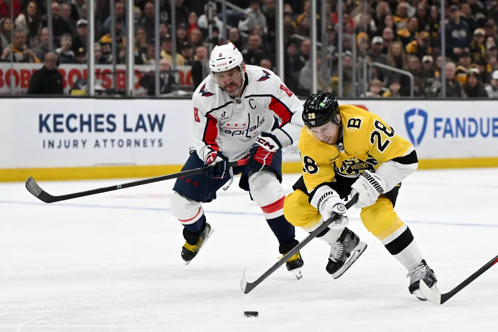 Mar 7, 2026; Boston, Massachusetts, USA; Boston Bruins center Elias Lindholm (28) skates against Washington Capitals left wing Alex Ovechkin (8) during the first period at the TD Garden. Mandatory Credit: Brian Fluharty-Imagn Images