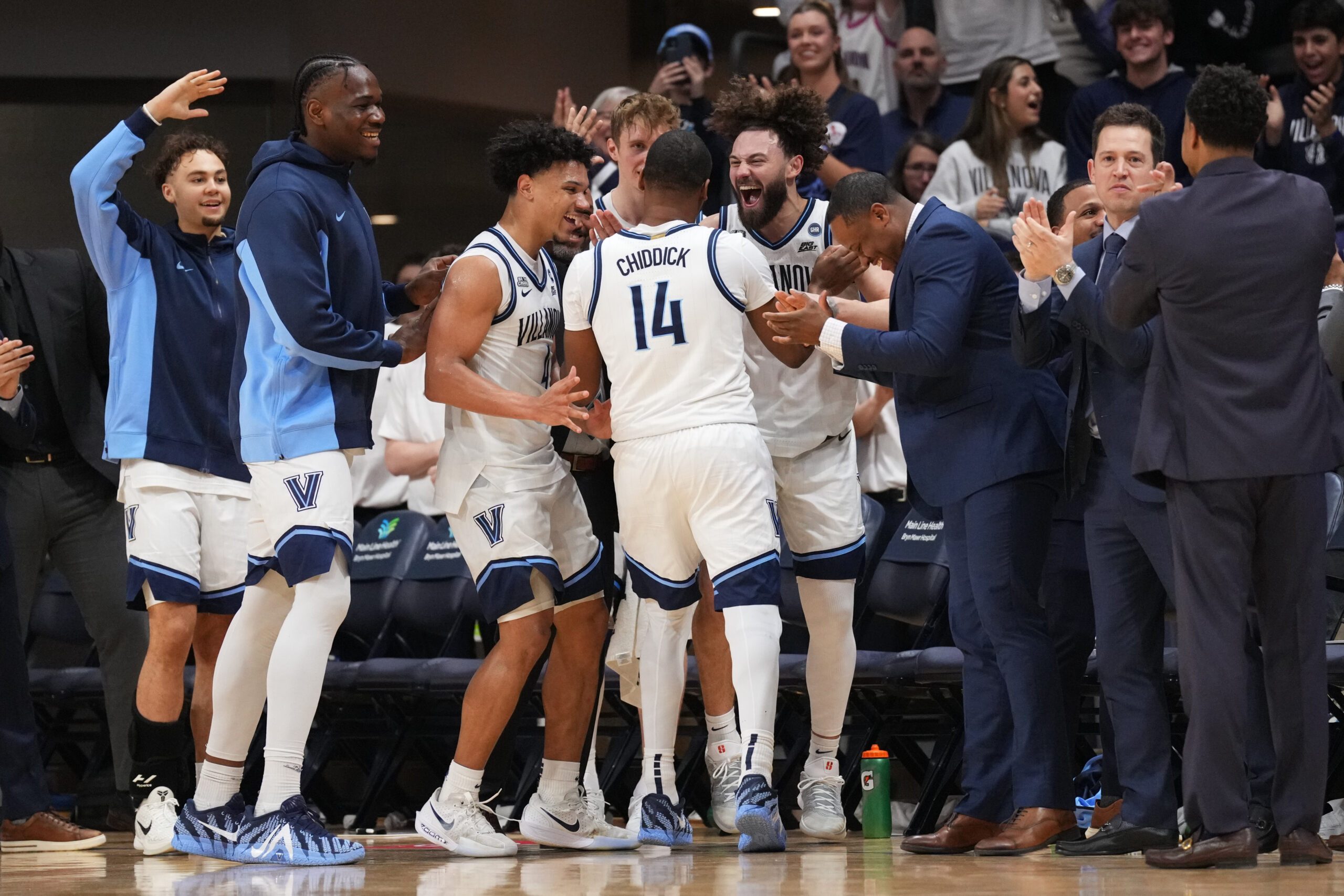 Mar 7, 2026; Villanova, Pennsylvania, USA; Villanova Wildcats guard Tyler Perkins (4) and guard Devin Askew (5) react with guard Wade Chiddick (14) against the Xavier Musketeers in the second half at William B. Finneran Pavilion. Mandatory Credit: Kyle Ross-Imagn Images