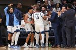 Mar 7, 2026; Villanova, Pennsylvania, USA; Villanova Wildcats guard Tyler Perkins (4) and guard Devin Askew (5) react with guard Wade Chiddick (14) against the Xavier Musketeers in the second half at William B. Finneran Pavilion. Mandatory Credit: Kyle Ross-Imagn Images