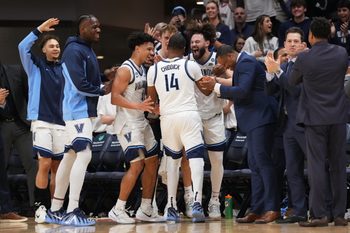 Mar 7, 2026; Villanova, Pennsylvania, USA; Villanova Wildcats guard Tyler Perkins (4) and guard Devin Askew (5) react with guard Wade Chiddick (14) against the Xavier Musketeers in the second half at William B. Finneran Pavilion. Mandatory Credit: Kyle Ross-Imagn Images