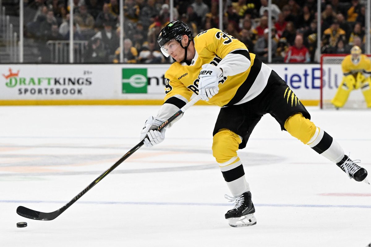 Mar 7, 2026; Boston, Massachusetts, USA; Boston Bruins center Morgan Geekie (39) takes a shot against the Washington Capitals during the third period at the TD Garden. Mandatory Credit: Brian Fluharty-Imagn Images