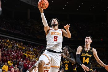 Mar 7, 2026; Ames, Iowa, USA; Iowa State Cyclones forward Joshua Jefferson (5) goes to the basket as Arizona State Sun Devils forward Andrija Grbovic (14) defends during the first half at James H. Hilton Coliseum. Mandatory Credit: Jeffrey Becker-Imagn Images