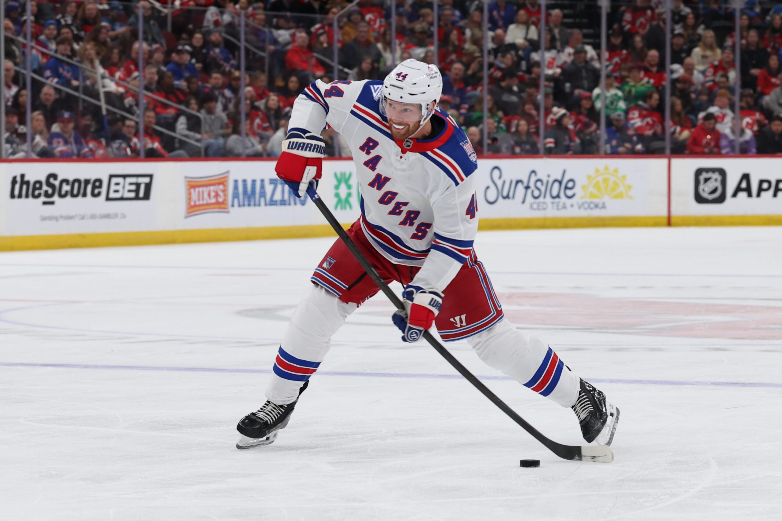 Mar 7, 2026; Newark, New Jersey, USA; New York Rangers defenseman Vladislav Gavrikov (44) takes a shot for a goal against the New Jersey Devils during the first period at Prudential Center. Mandatory Credit: Thomas Salus-Imagn Images