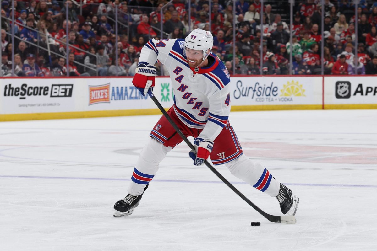 Mar 7, 2026; Newark, New Jersey, USA; New York Rangers defenseman Vladislav Gavrikov (44) takes a shot for a goal against the New Jersey Devils during the first period at Prudential Center. Mandatory Credit: Thomas Salus-Imagn Images