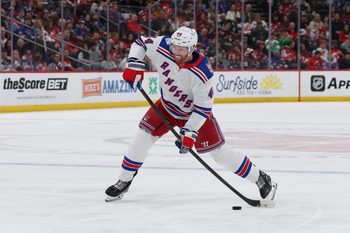 Mar 7, 2026; Newark, New Jersey, USA; New York Rangers defenseman Vladislav Gavrikov (44) takes a shot for a goal against the New Jersey Devils during the first period at Prudential Center. Mandatory Credit: Thomas Salus-Imagn Images