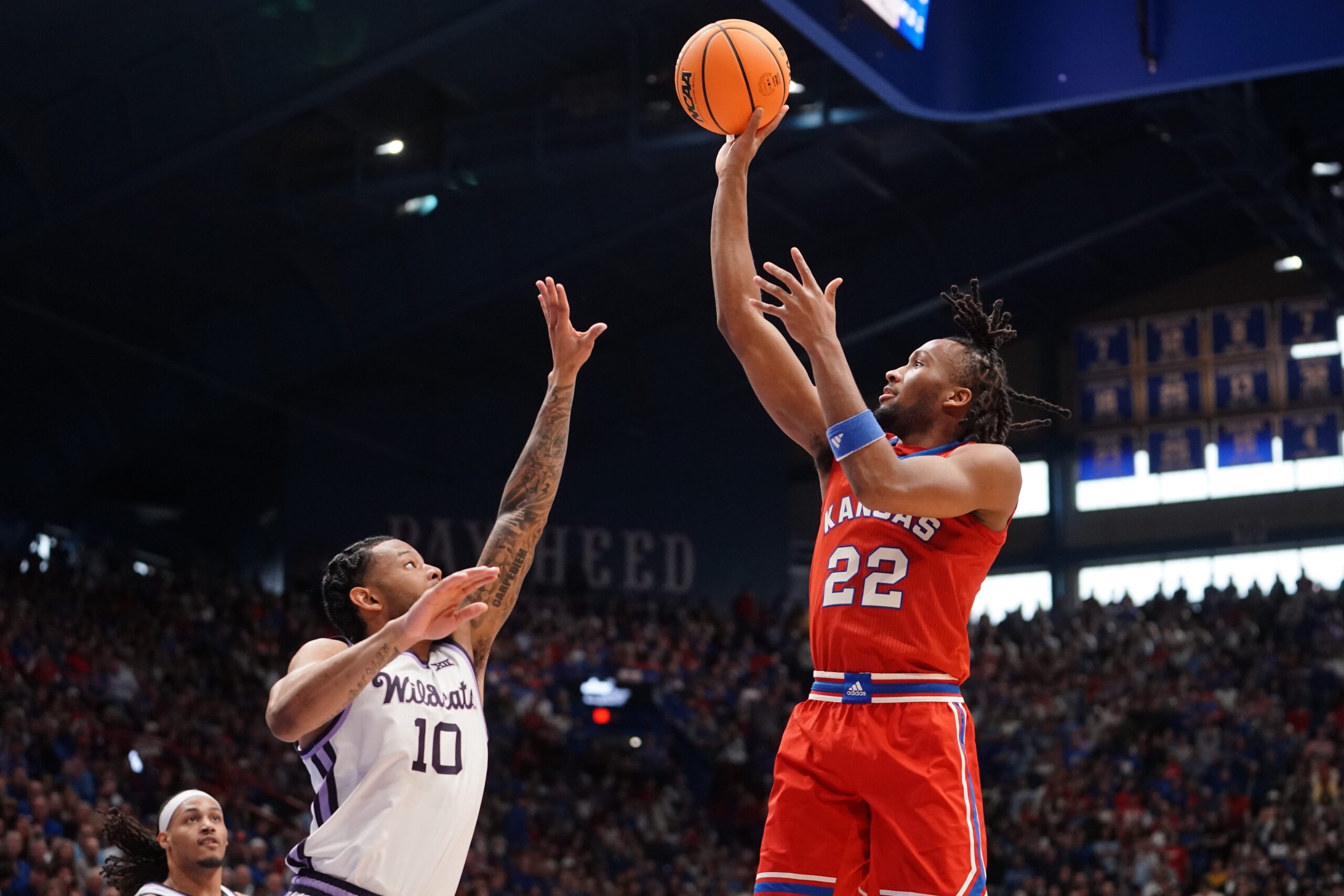 Kansas Jayhawks guard Darryn Peterson (22) shoots the ball against Kansas State Wildcats guard David Castillo (10) during the Sunflower Showdown game in Lawrence, Kansas, on Saturday, March 7, 2026.
