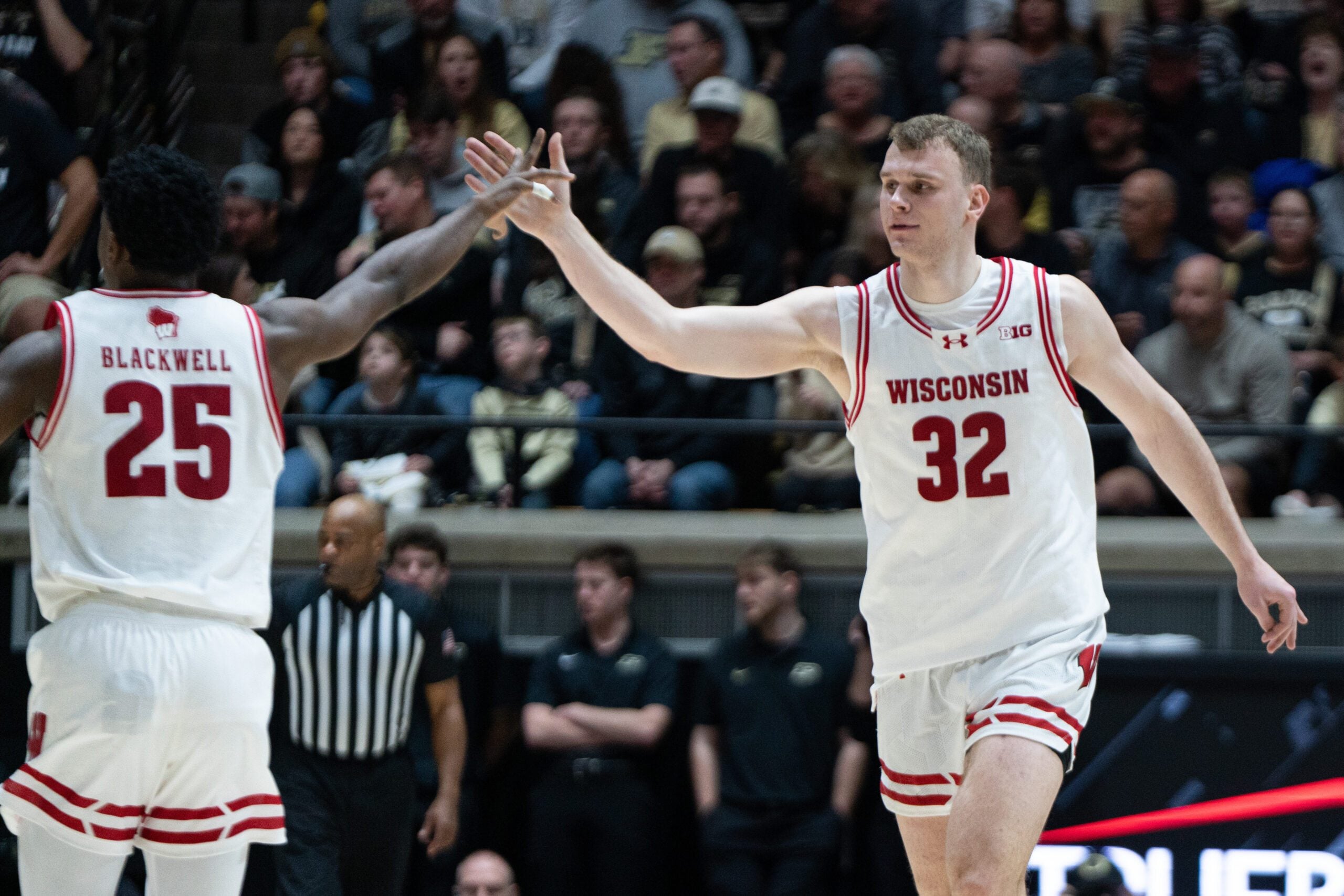 Mar 7, 2026; West Lafayette, Indiana, USA; Wisconsin Badgers forward Aleksas Bieliauskas (32) high fives Wisconsin Badgers guard John Blackwell (25) during the second half at Mackey Arena. Mandatory Credit: Jacob Musselman-Imagn Images