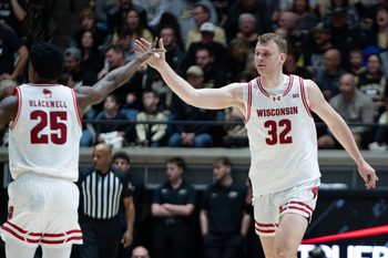 Mar 7, 2026; West Lafayette, Indiana, USA; Wisconsin Badgers forward Aleksas Bieliauskas (32) high fives Wisconsin Badgers guard John Blackwell (25) during the second half at Mackey Arena. Mandatory Credit: Jacob Musselman-Imagn Images