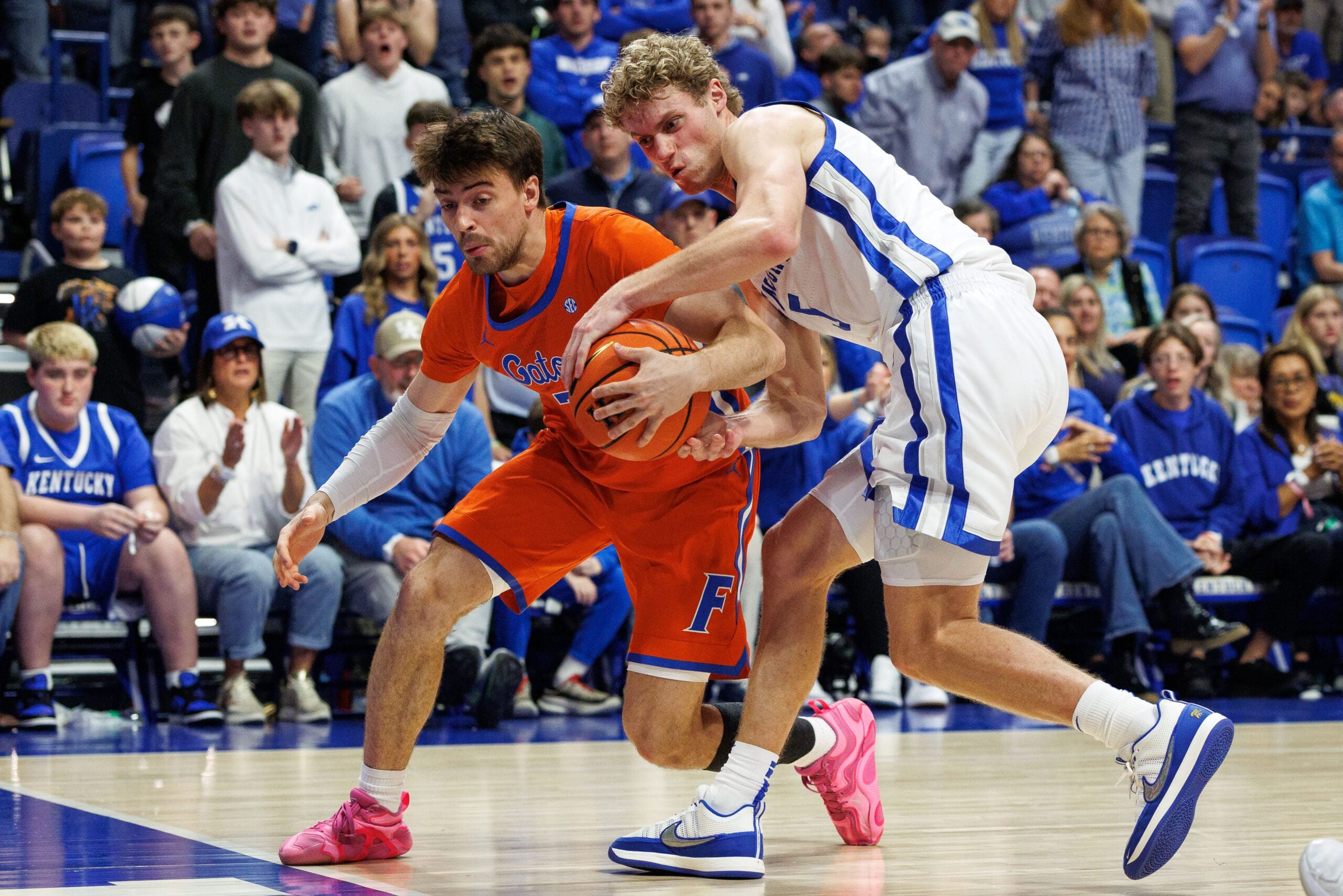 Mar 7, 2026; Lexington, Kentucky, USA; Kentucky Wildcats guard Collin Chandler (5) attempts to steal the ball from Florida Gators guard Urban Klavzar (7) during the second half at Rupp Arena at Central Bank Center. Mandatory Credit: Jordan Prather-Imagn Images